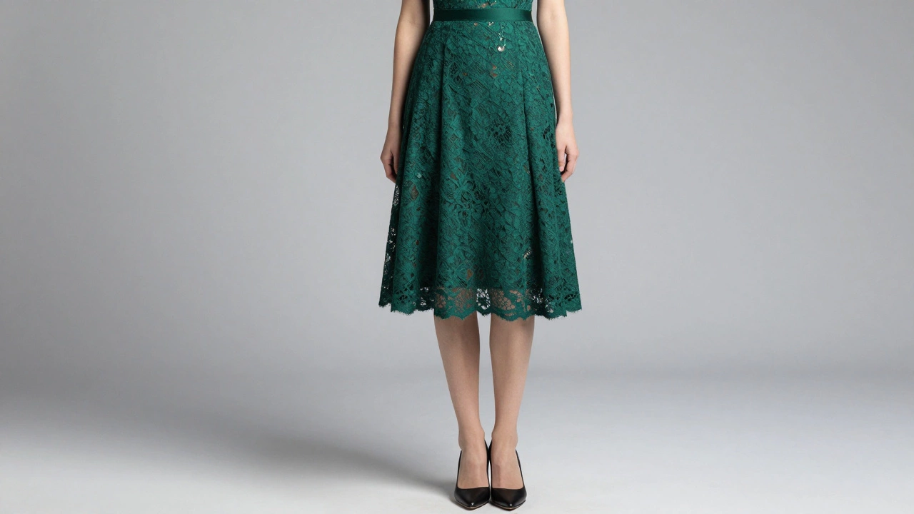 Emerald green tea-length lace dress falling between the knee and ankle